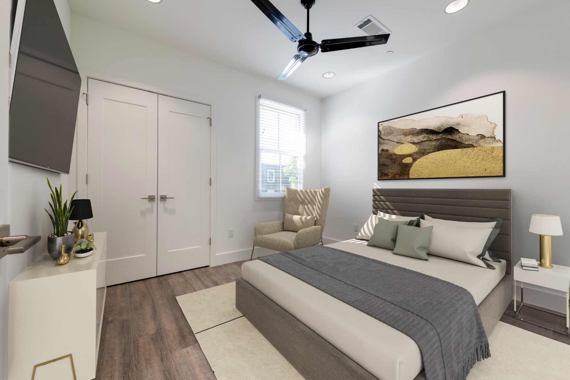 Unit 4-2 bedroom with accent chair and art
